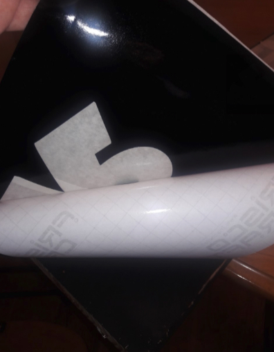 Peel the backing from the vinyl decal