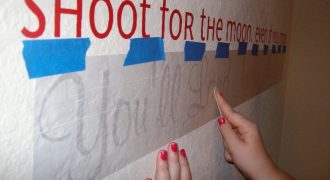 Rubbing the vinyl letters against the wall